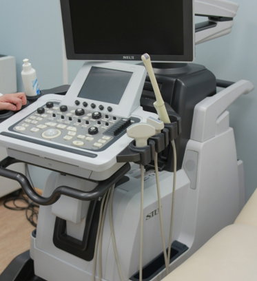 a medical machine with a monitor on top of it