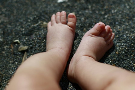 persons feet on gray concrete floor