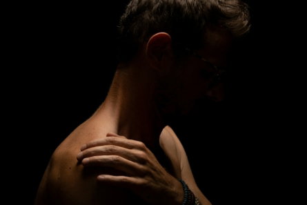 a man with his hands together