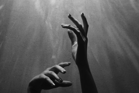 person raising both hands